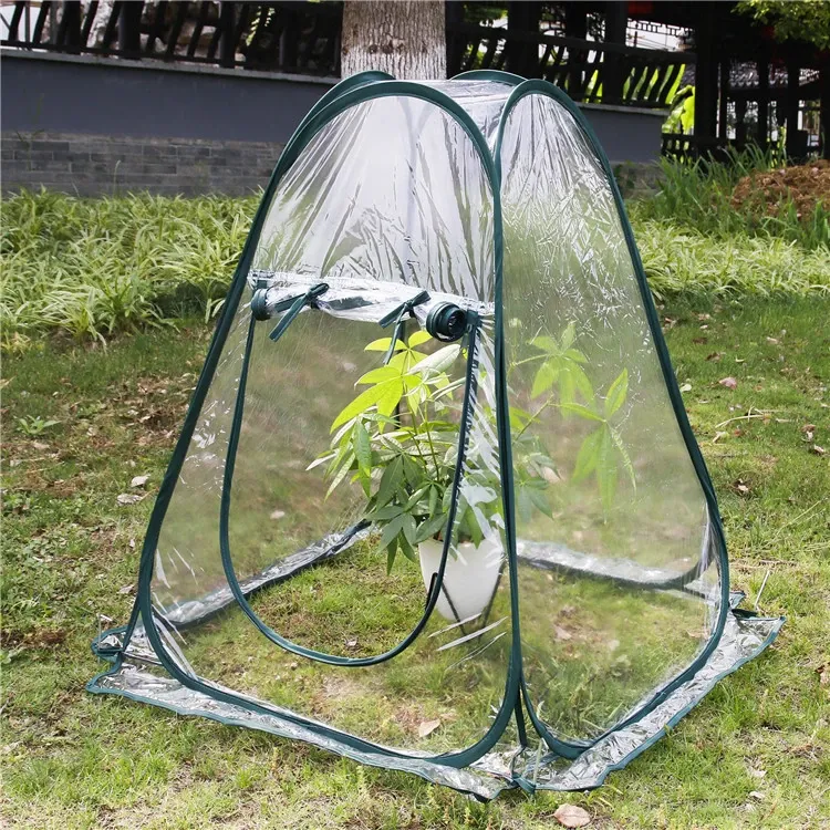 Mini greenhouse in a garden; plant and pot not included